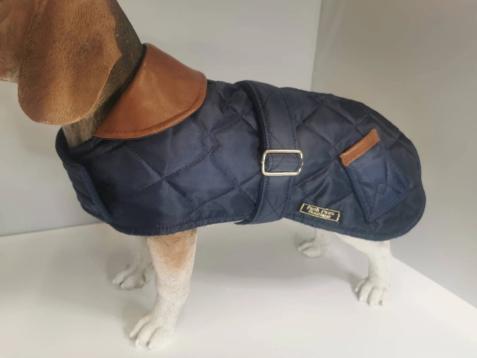 Navy blue quilted dog coat with genuine leather trims