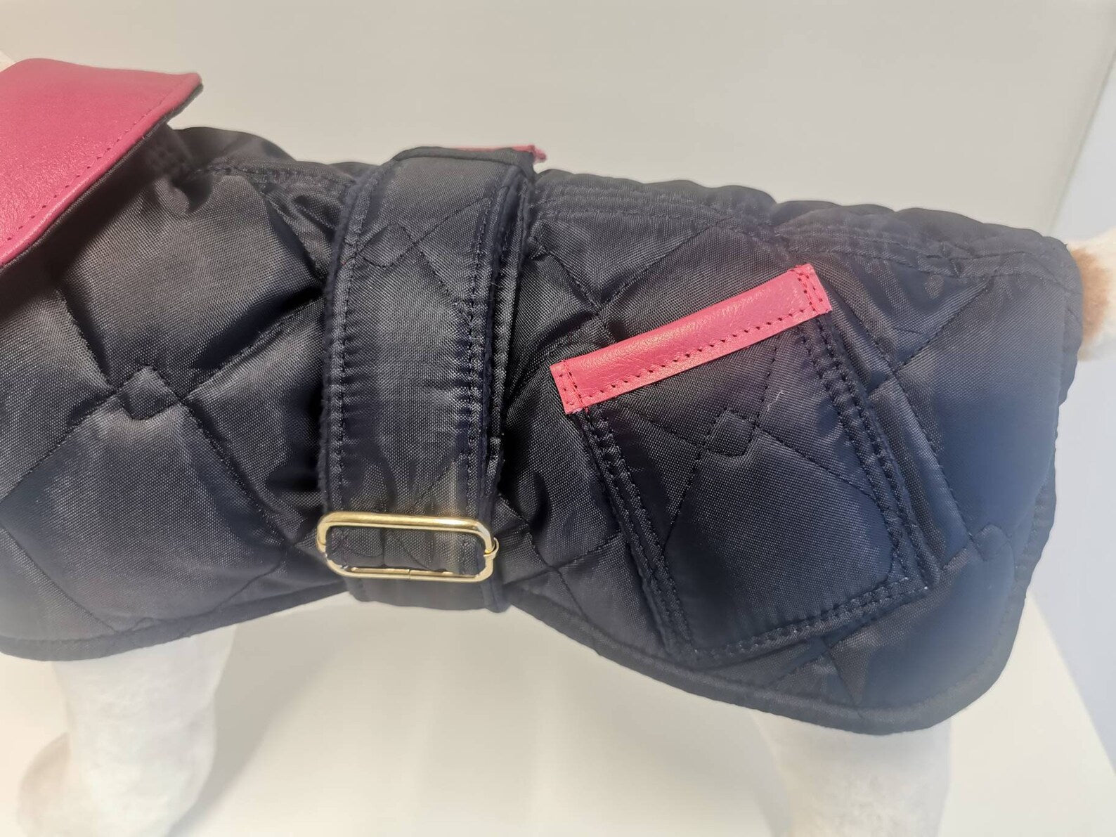 Navy blue quilted dog coat with genuine pink leather trims